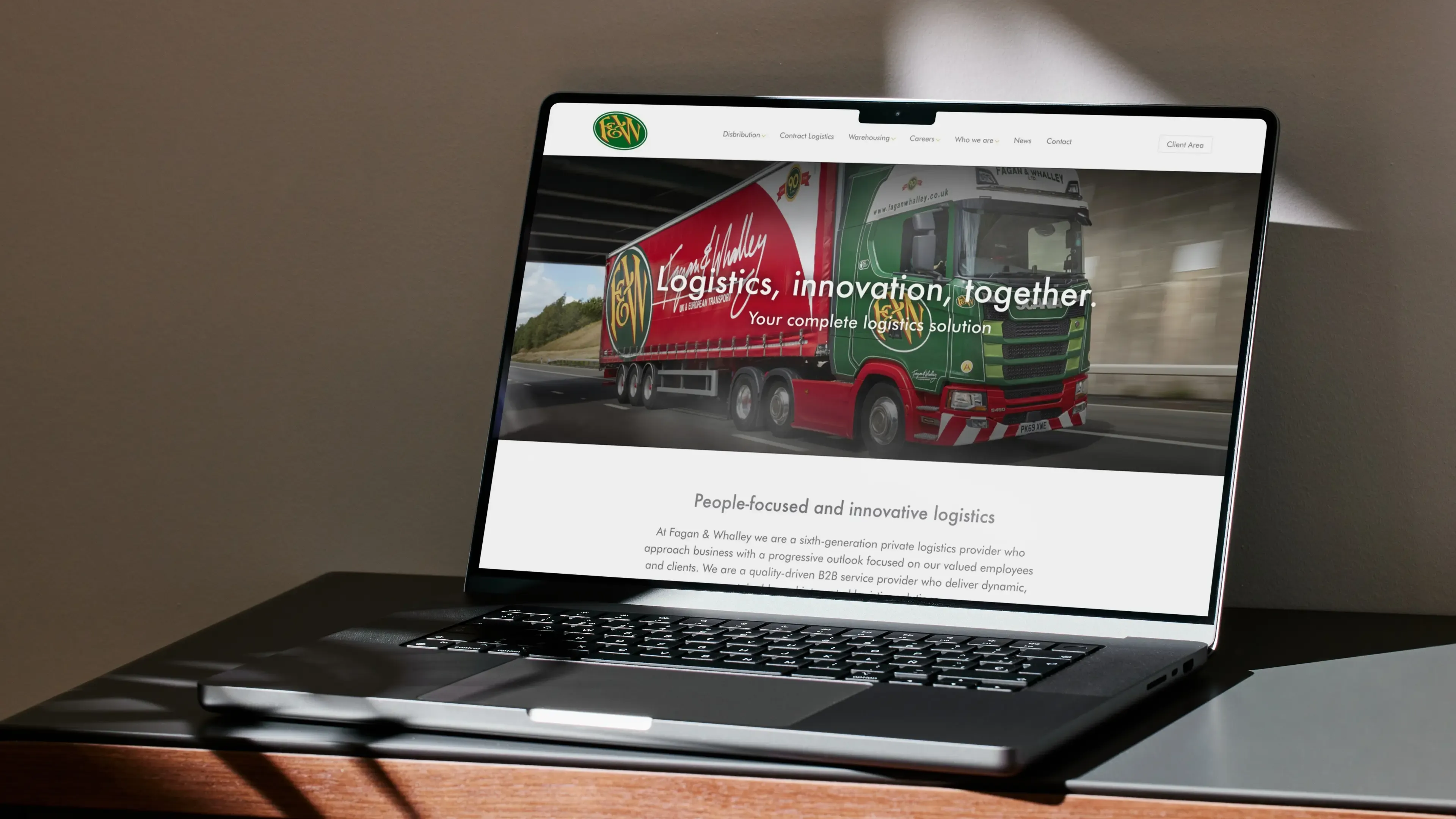 A laptop showing the fagan and whalley website
