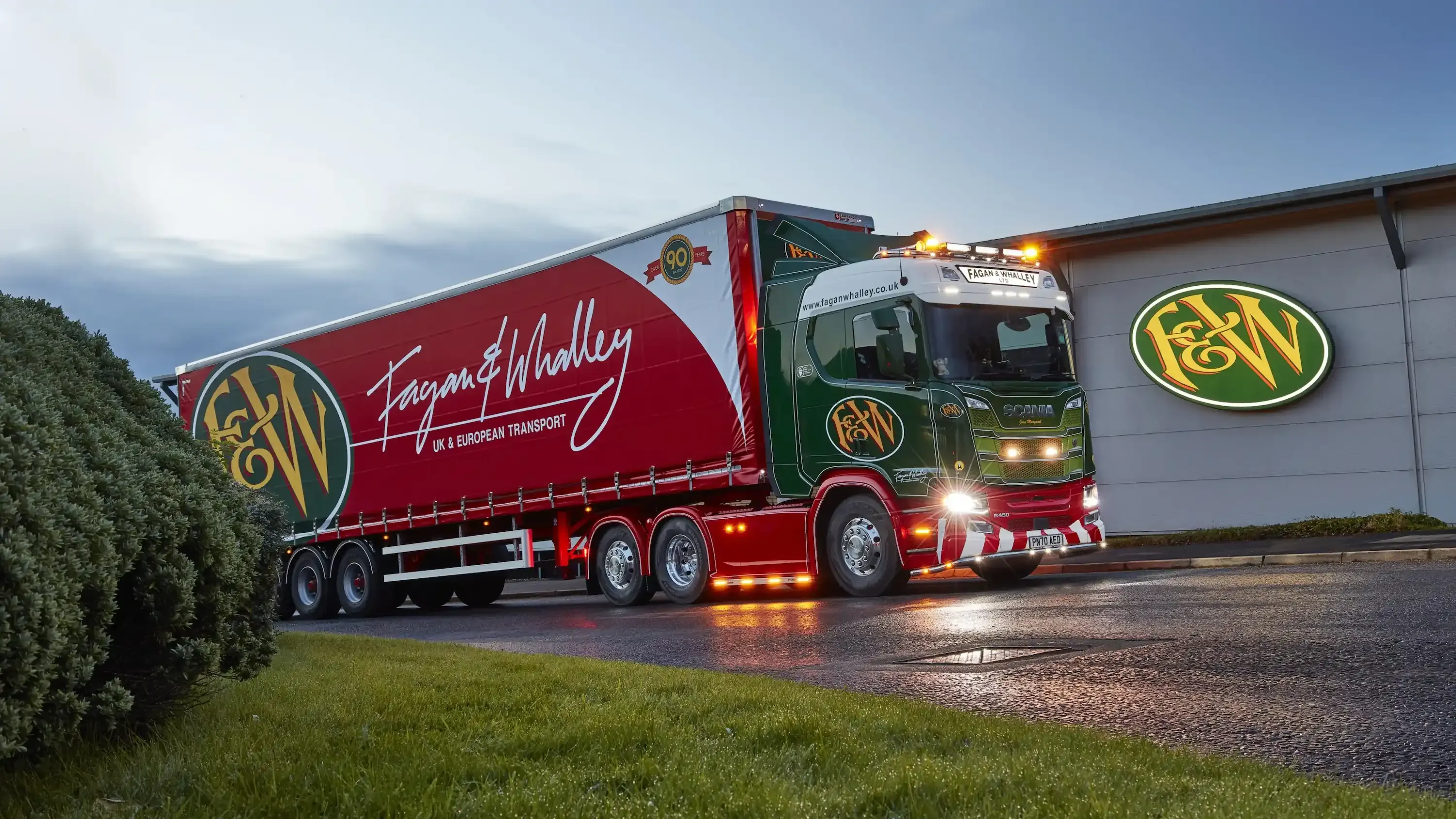 A fagan & whalley truck outside a warehouse