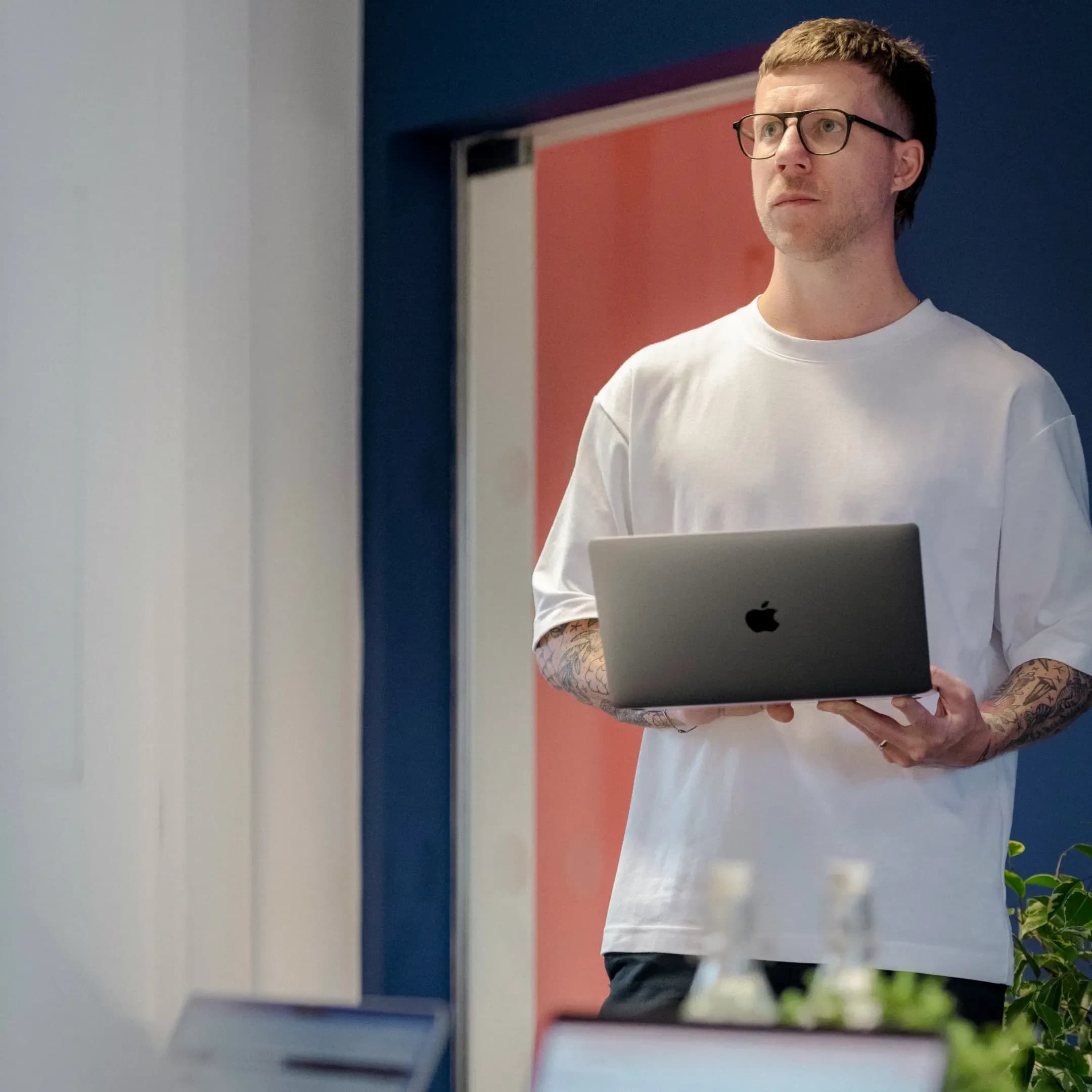 Michael holding a laptop